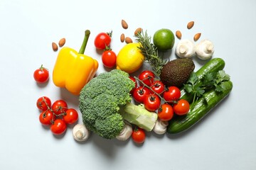 Clean healthy eating habits concept. Fruits, herbs, greens and vegetables mix, colorful juicy organic detox smoothie juice ingredients, color background. Vegan vegetarian diet food