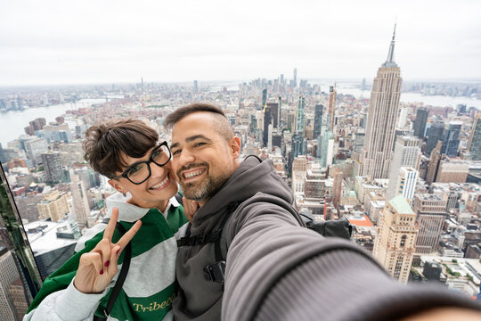 Tourists taking a selfie with the empire state building