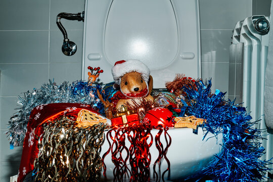 flush toilet full of christmas ornaments