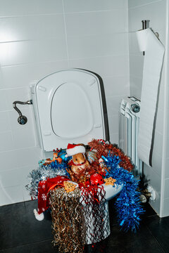 christmas ornaments into the toilet bowl