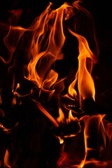 Burning wood in the fireplace in the house. Cozy atmosphere with a burning 