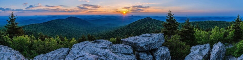 Obraz premium A panoramic view of a sunset over rolling mountains and lush greenery.