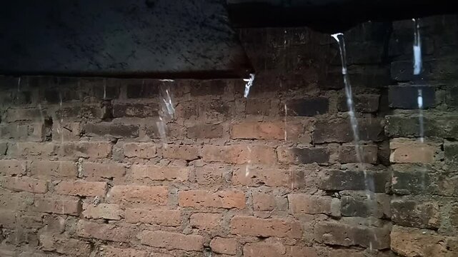 rainwater drains from the roof tiles.