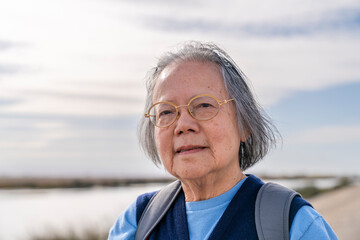 camera aware portrait senior woman