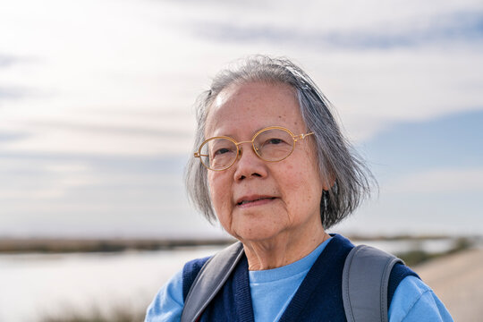 camera aware portrait senior woman