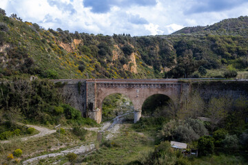Old bridge and nature, Messina, Sicily, Italy
