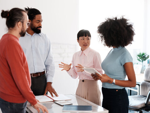 Diverse Team Engaging in a Collaborative Office Discussion