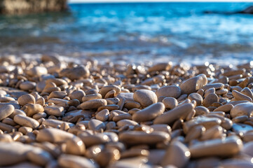 little rounded rocks on the beach