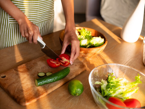 Preparing Fresh Vegetable Salad with Tomatoes and Cucumbers