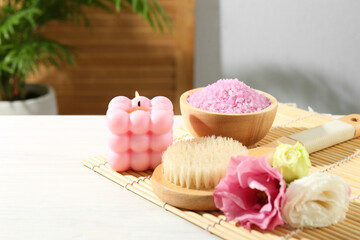Composition with cosmetic products for spa treatment on white wooden table, space for text