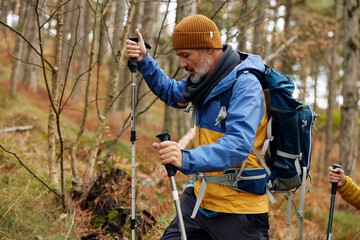 Portrait of a man hiking through the forest