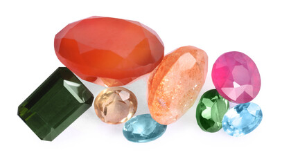 Different colorful shiny gemstones isolated on white