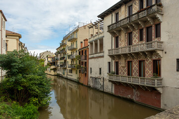 canals cross the city of Padua with buildings
