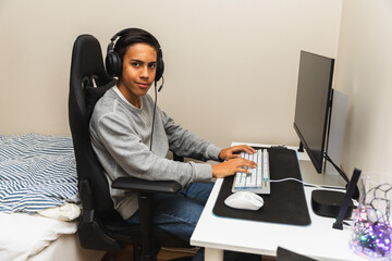 Teenager Playing Video Games at His Desk