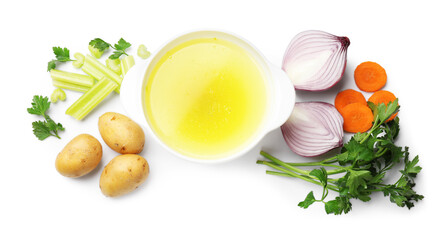 Tasty chicken bouillon in bowl and ingredients isolated on white, top view