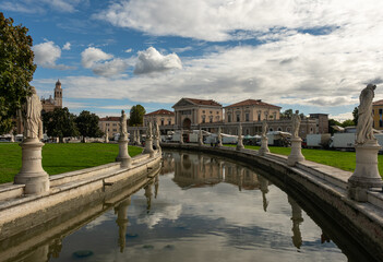 This video shows a train moving along tracks in an industrial setting, highlighting the link between transportation and industry amidst urban progress