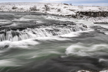 long exposure ice winter Iceland water running waterfall