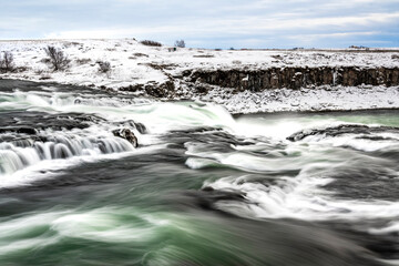 long exposure ice winter Iceland water running waterfall