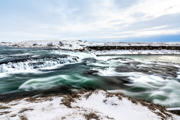 long exposure ice winter Iceland water running waterfall