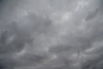 Cold and dreary winter sky with thick gray-white clouds.
