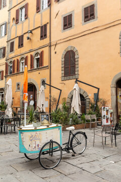 old ice cream cart parked on a street