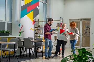 Teachers communicate with each other in the school interior