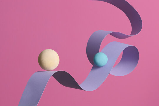 Abstract Composition with Colorful Balls and Curved Paper