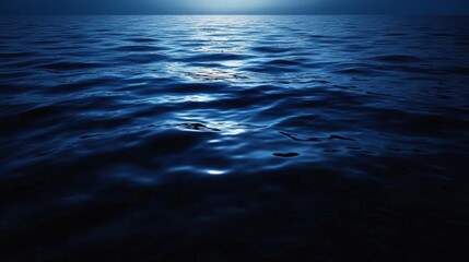 Naklejka premium Mystical Night Ocean: Deep Blue Water Under Moonlight