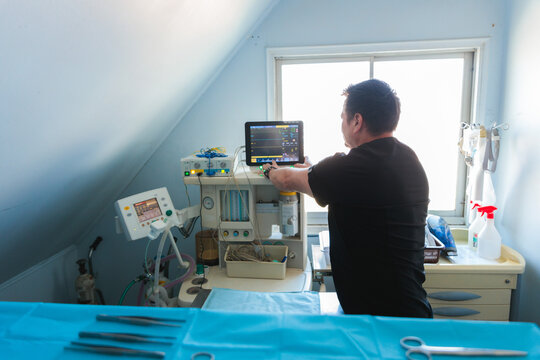 Vet Doctor Organizing Surgery Room