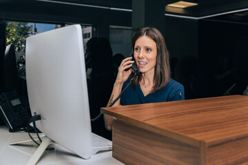 Receptionist Assisting Patient at Dental Clinic Front Desk