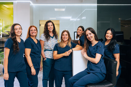 Professional Dental Team Poses in Modern Clinic Setting