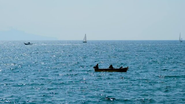 Fishing boat in front of the Gulf of Naples. High quality 4k footage