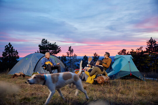 Friends spending time on a mountain camping 