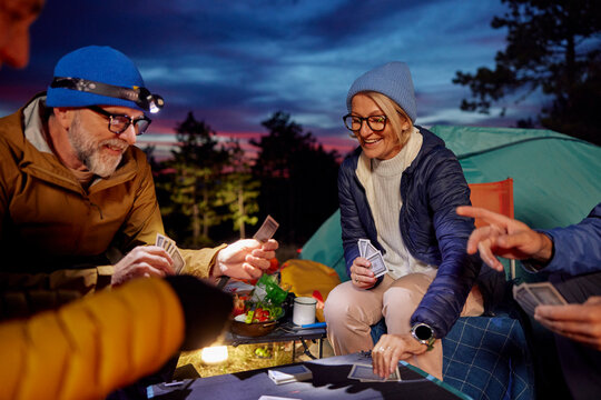 People enjoy playing cards in nature