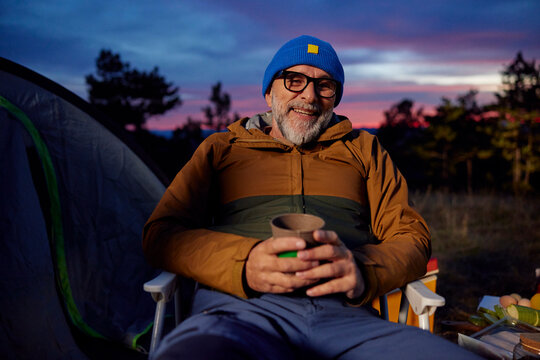 Portrait of a relaxed man at the camp