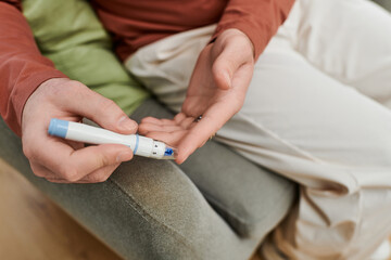 Young man managing diabetes in a modern apartment during daily routine