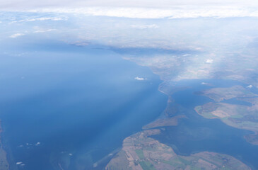 View from airplane window to earth's surface
