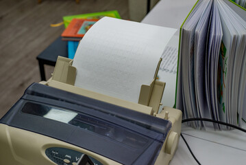 Special Printer Prints Multiplication Table in Braille with copyspace