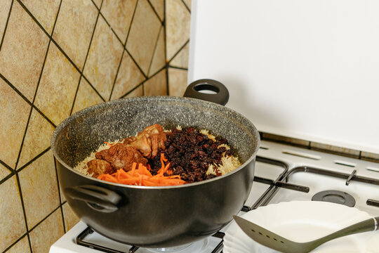 Traditional afghani pilaf Kabuli Pulao in the pot