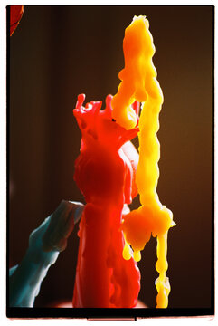 Colorful candle drippings create abstract shapes and patterns