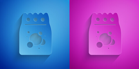 Paper cut Laundry detergent for automatic wash machine icon isolated on blue and purple background. Paper art style. Vector