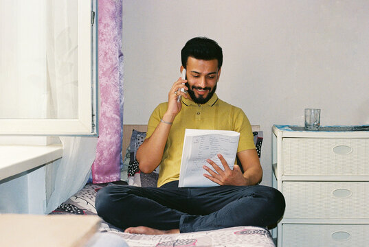 Indian student studying in his room at the hostel.