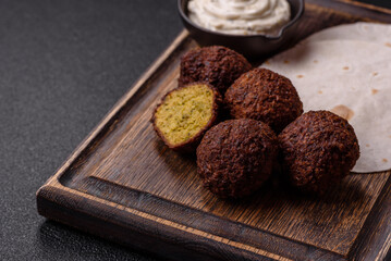 Fried chickpea falafel balls with salt, spices and herbs