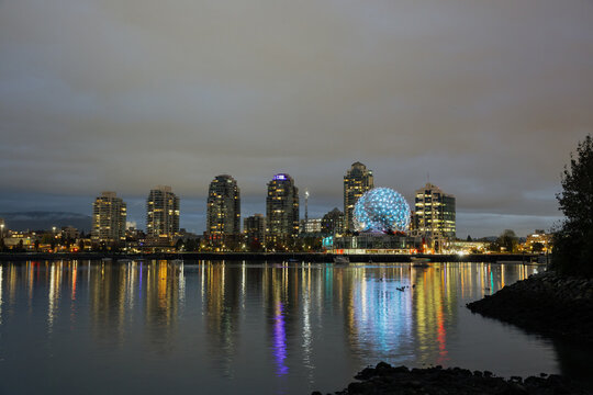 Beautiful Night Skyline of Vancouver with Reflections on Water