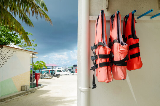 Bright Orange Life Jackets Hanging in Maafushi