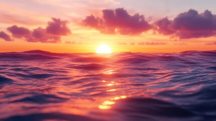 Obraz premium Vibrant sunset over calm ocean waves.