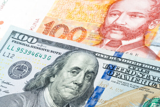 US 100 dollars and Croatian 100 kuna banknotes. International trade concept