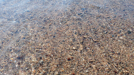 Much stones in the sea, river, lake, ocean water. Nature background.