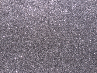 Silver sparkle background. Silver glitter background. Metallic gray glimmer. Abstract twinkle texture. Glitter surface. Glimmer layout. Holiday layout. Diamond luxury surface. Celebration  background.