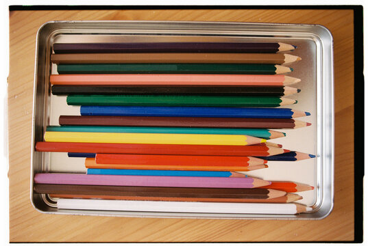 Colored Pencils in a Tin Box